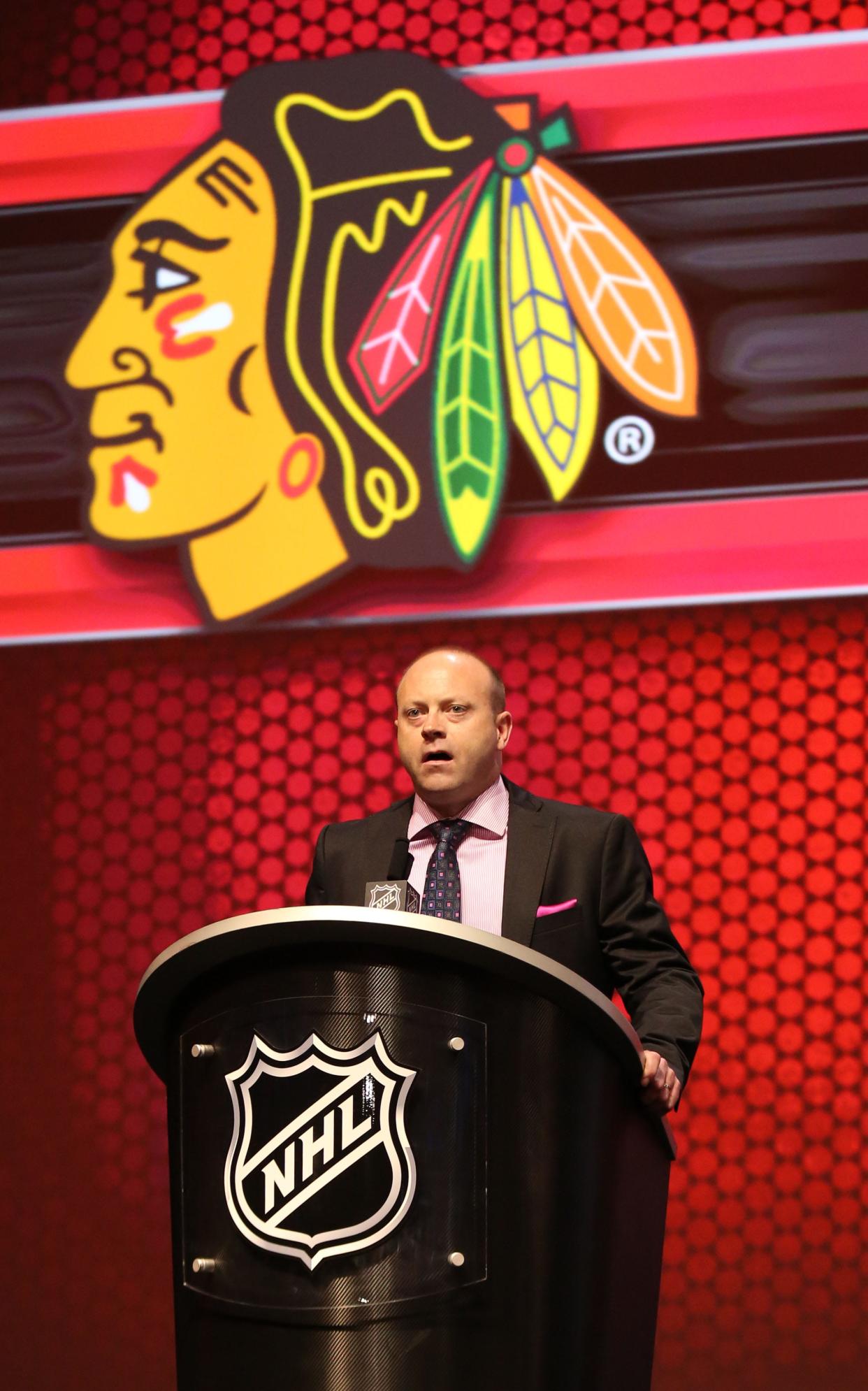 Jun 27, 2014; Philadelphia, PA, USA; Chicago Blackhawks general manager Stan Bowman announces Nick Schmaltz (not pictured) as the number twenty overall pick to the Chicago Blackhawks in the first round of the 2014 NHL Draft at Wells Fargo Center. Mandatory Credit: Bill Streicher-USA TODAY Sports