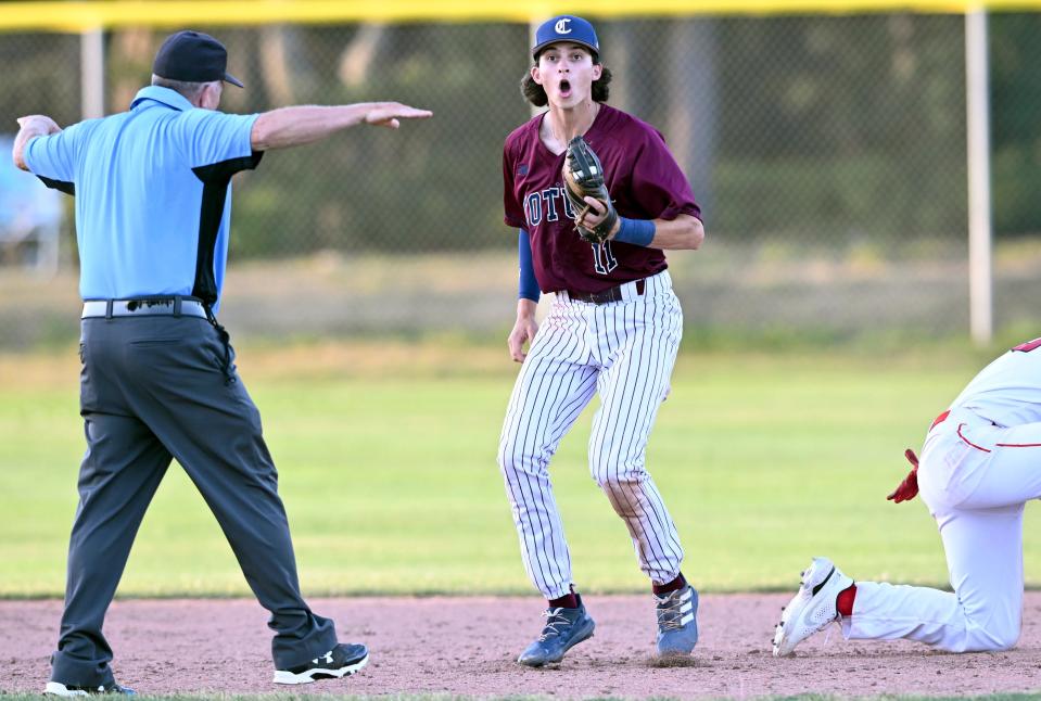 Cotuit second baseman Brooks Baldwin expresses disbelief in the call after tagging Jack Costello of Y-D diving back to second.