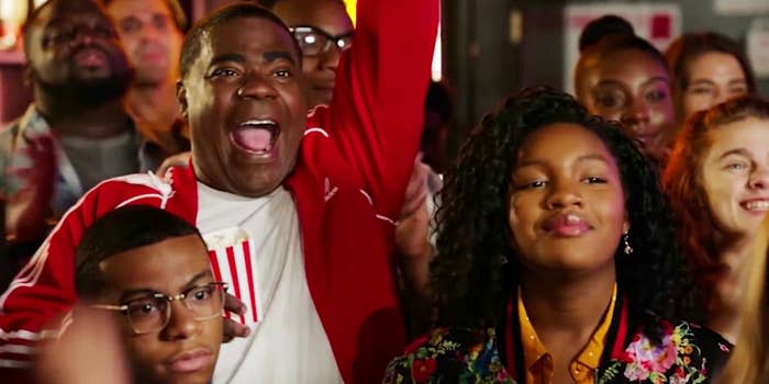 Tracey Morgan cheering with Glee in a scene from The Last O.G