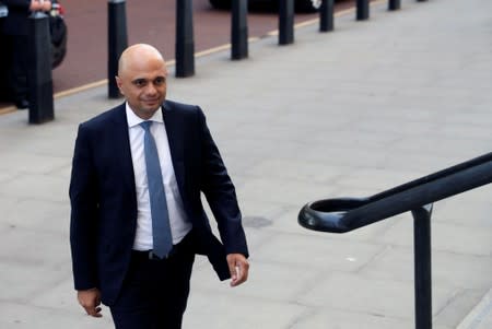 Britain's new Chancellor of the Exchequer Sajid Javid arrives at the treasury in London