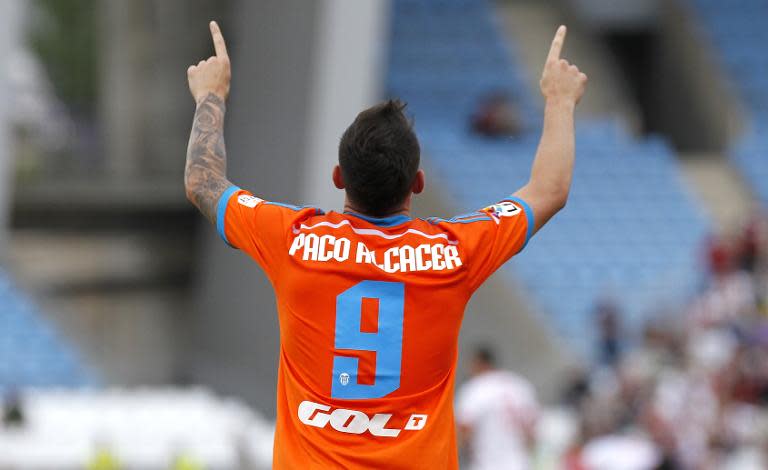 Valencia's forward Paco Alcacer celebrates after scoring during the match Almeria vs Valencia on May 23, 2015