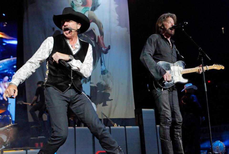 Kix Brooks, left, and Ronnie Dunn, of country music duo Brooks & Dunn, perform concert as part of their "The Last Rodeo Tour" at the Ford Center in Oklahoma City, Friday, August 20, 2010.