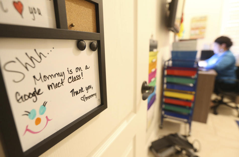 Linda Davila-Macal, a seventh grade reading teacher at BL Garza Middle School in Edinburg, Texas, works during her virtual classroom at her home Monday, Aug. 31, 2020.(Delcia Lopez/The Monitor via AP)