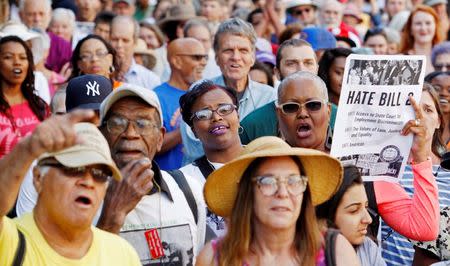 Members of the black community join a diverse crowd of protesters opposing North Carolina's HB2 "bathroom law" that restricts members of the LGBT community from using the bathroom of their choice, during a demonstration outside the state legislature in Raleigh, North Carolina on May 16, 2016. REUTERS/Jonathan Drake