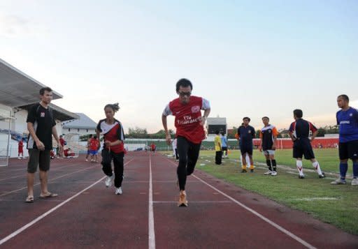 Laotion coach Chaleunsouk Aoudomphanh (L) watches athletes Kilakone Siphonexay (3rd L) and Lealy Phoukhavont (2nd L) during their training session at the stadium in Vientiane on May 4. When it comes to the Olympics, there are the strong nations, the less good, the weak and the abject. Communist Laos is in the last category. But with facilities like this, it's hardly a surprise