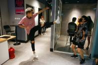 Members of China's all-girl "boyband" FFC-Acrush wait for the start of a rehearsal at a dance studio in Beijing April 27, 2017. REUTERS/Thomas Peter/Files