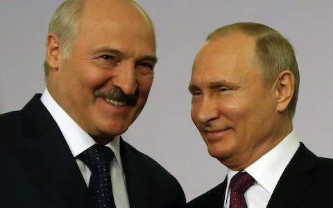 Mr Lukashenko and Mr Putin shake hands in Sochi during a meeting of the Eurasian Economic Union, Russia's answer to the European Union - Credit: Mikhail Svetlov/Getty Images