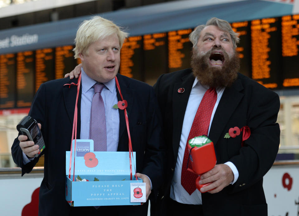 The Mayor of London Boris Johnson (left) and actor Brian Blessed sell poppies in Liverpool Street Station in central London.