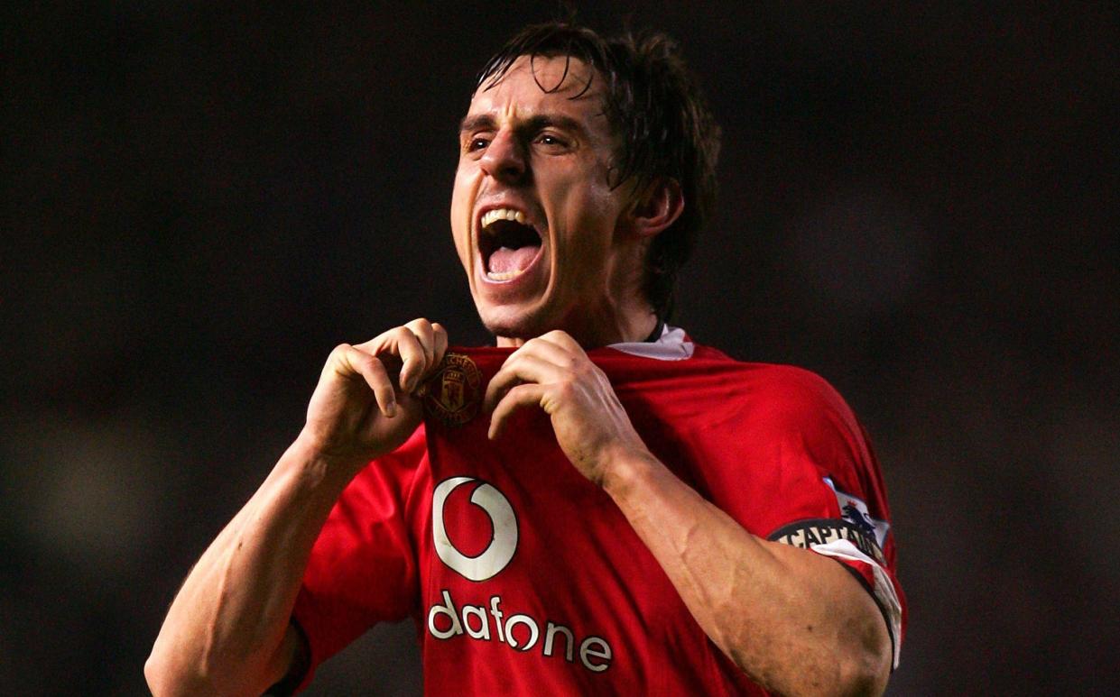 Gary Neville celebrates in front of Liverpool fans during Man Utd vs Liverpool in 2006