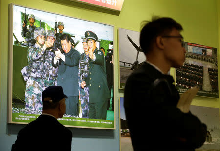 People visit an exhibition displaying China's achievements for the past five years, as a part of the celebrations of the upcoming 19th National Congress of the Communist Party of China (CPC) at Beijing Exhibition Centre in Beijing, China October 10, 2017. REUTERS/Jason Lee