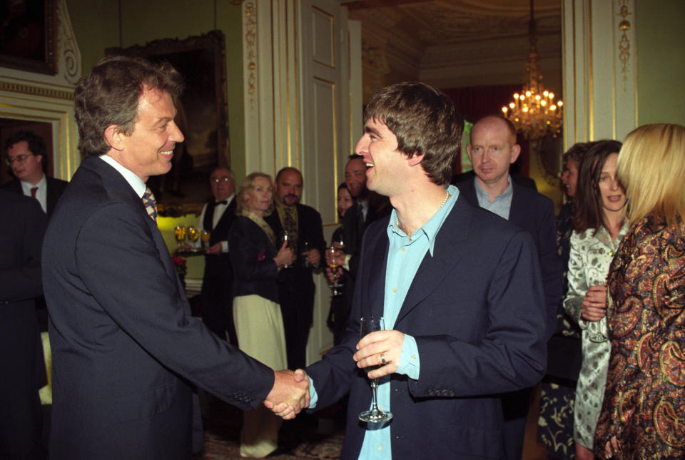 Prime Minister Tony Blair (left) meets Oasis star Noel Gallagher at a reception held at 10 Downing Street.   (Photo by Rebecca Naden - PA Images/PA Images via Getty Images)