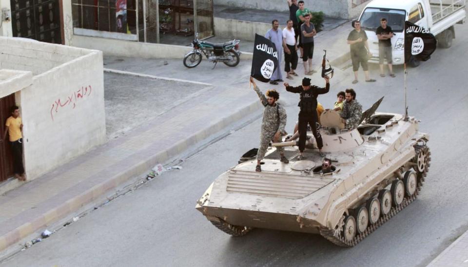 <div class="inline-image__caption"><p>Militant Islamist fighters take part in a military parade along the streets of northern Raqqa province June 30, 2014. Militant Islamist fighters held a parade in Syria's northern Raqqa province to celebrate their declaration of an Islamic "caliphate" after the group captured territory in neighboring Iraq, a monitoring service said. The Islamic State, an al Qaeda offshoot previously known as Islamic State in Iraq and the Levant (ISIL), posted pictures online on Sunday of people waving black flags from cars and holding guns in the air, the SITE monitoring service said.</p></div> <div class="inline-image__credit">Reuters</div>