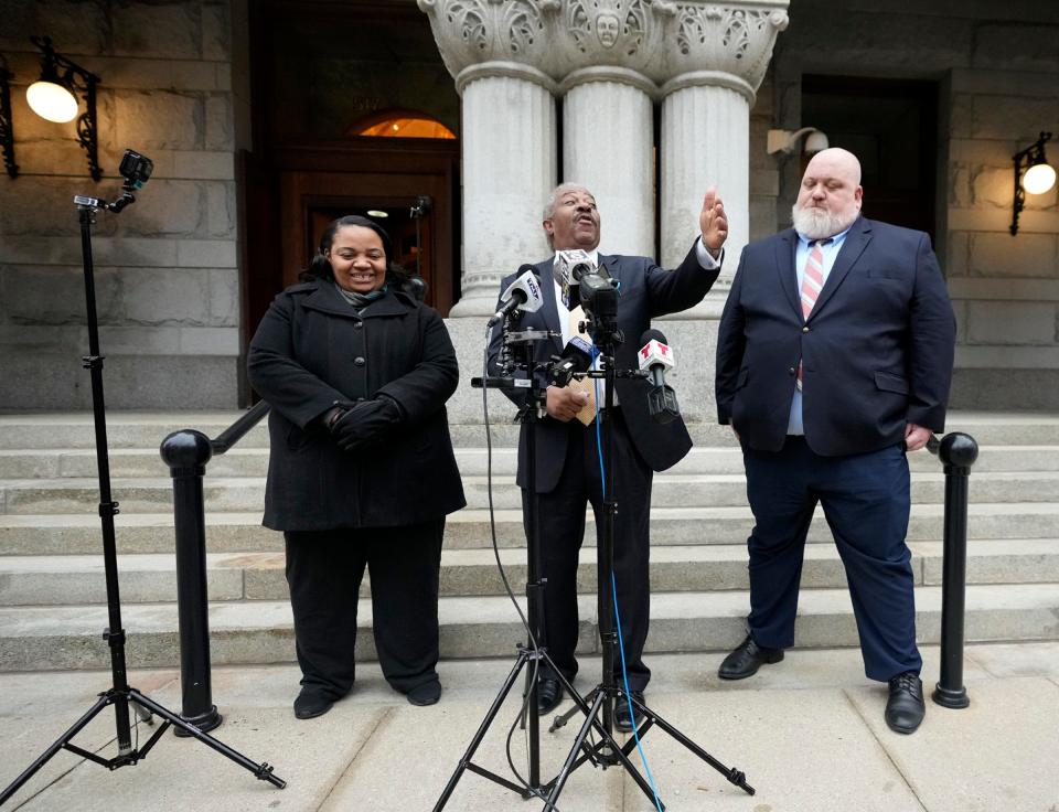 City Attorney Tearman Spencer, center, speaks alongside  Ald. Milele Coggs, left, and deputy city attorney Robin Pederson during a news conference outside the Federal Courthouse on East Wisconsin Avenue in Milwaukee on Wednesday, March 22, 2023. Common Council members on Tuesday backed legislation authorizing Spencer to hire outside counsel that would advise the city regarding the Kia and Hyundai thefts that have plagued Milwaukee.