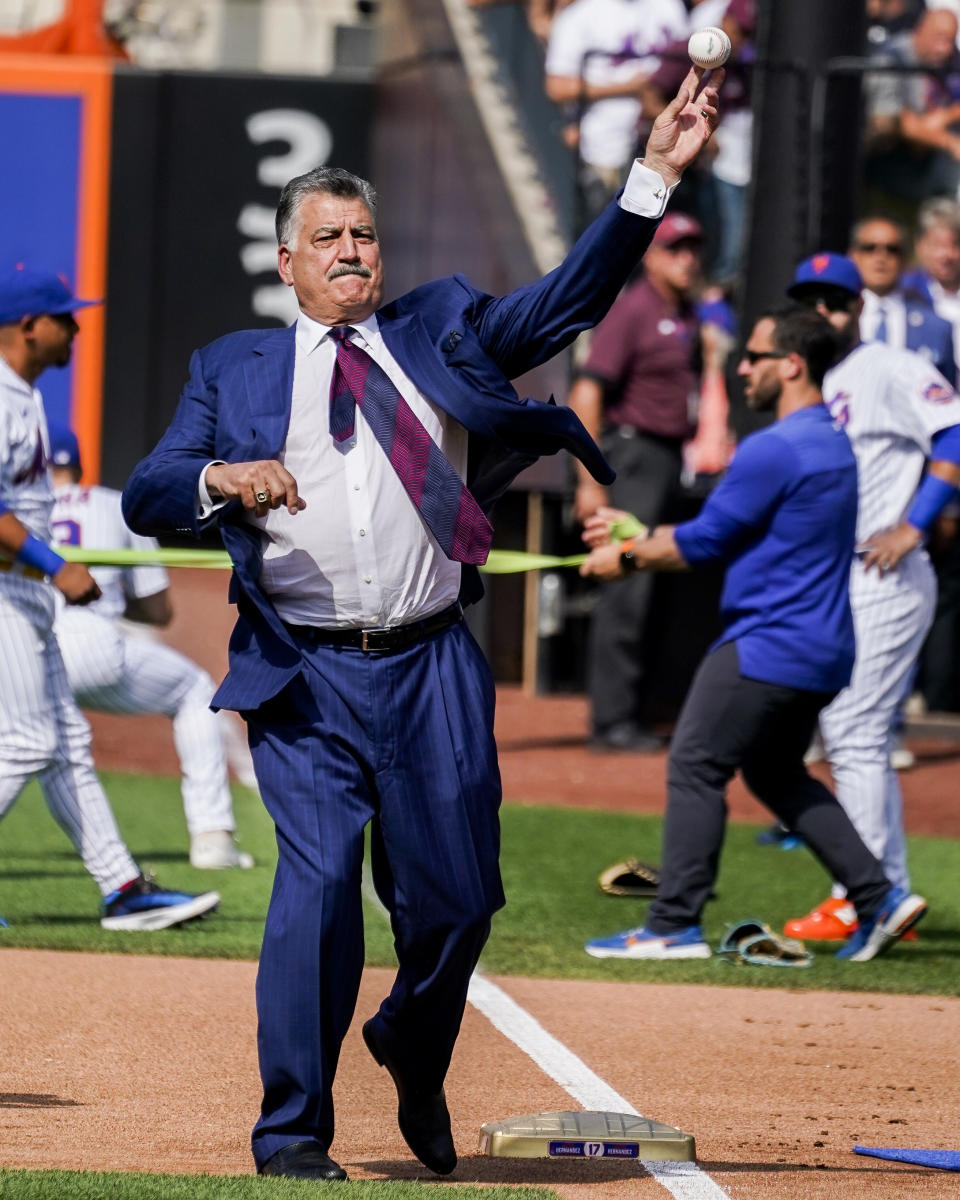 New York Mets announcer and former player Keith Hernandez throws the ceremonial first pitch from first base after a pre-game ceremony to retire his player number before a baseball game between the Mets and Miami Marlins, Saturday, July 9, 2022, in New York. (AP Photo/John Minchillo)