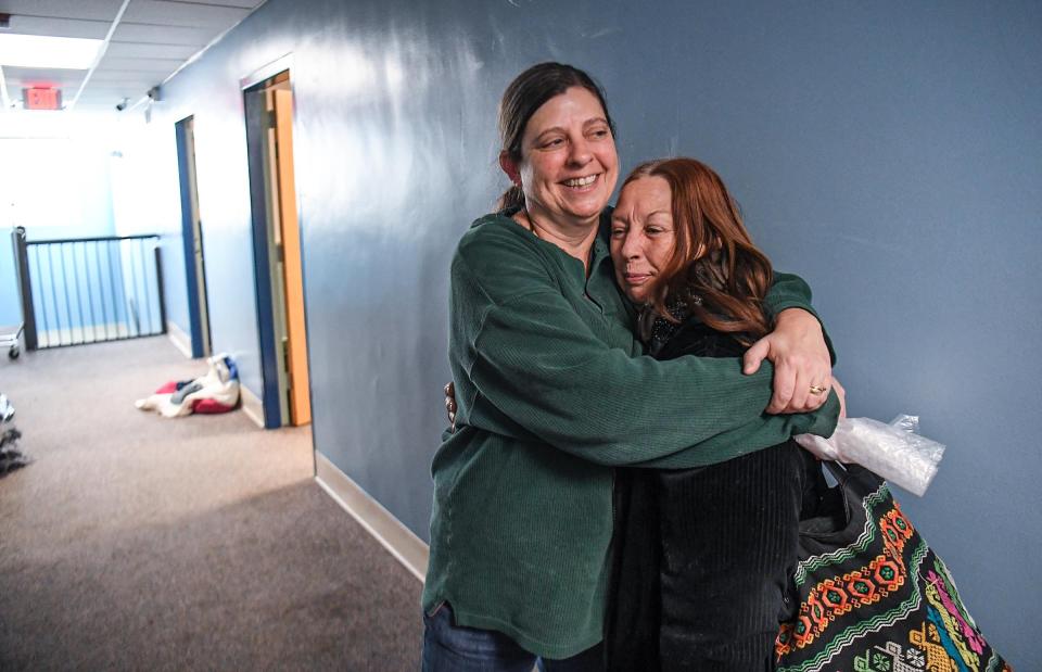 Zoe Hale, left, Hope Ministries Director of Operations hugs shelter visitor Denise Kelly of Anderson staying out of the cold weather. The average number of people who use the shelter beds is 80, but with the recent freezing nights, as many as 30 more were accommodated to help homeless and people without warm shelter, in their time of need.