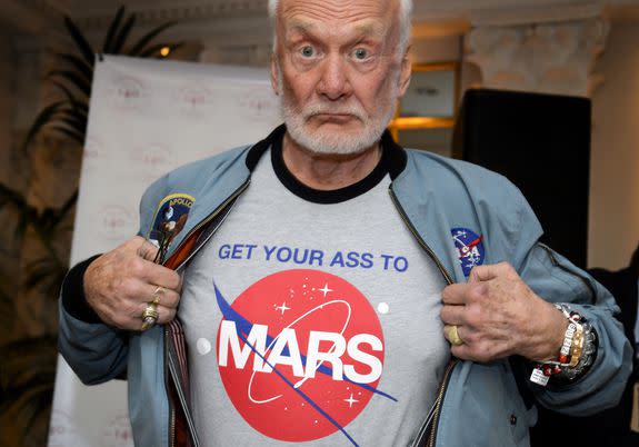 Former NASA astronaut Buzz Aldrin shows the t-shirt he wears promoting Mars exploration.