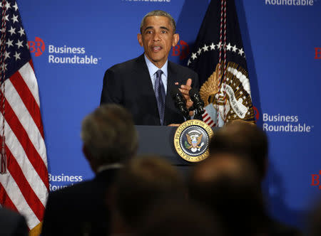 U.S. President Barack Obama answers questions from business leaders while at the quarterly meeting of the Business Roundtable in Washington, December 3, 2014. REUTERS/Larry Downing