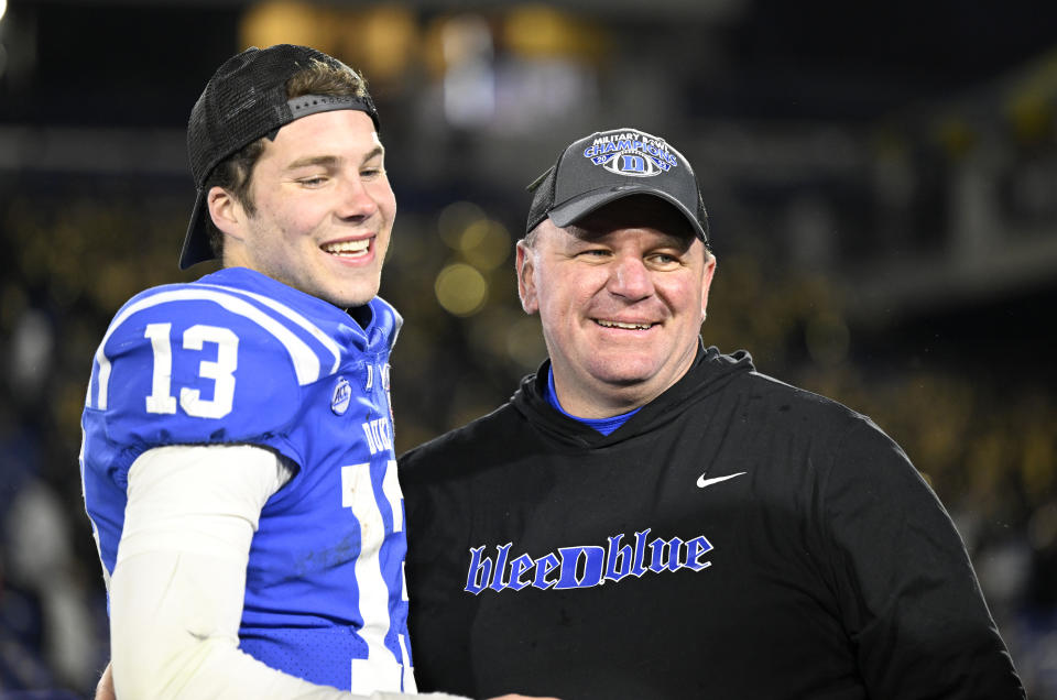 ANNAPOLIS, MARYLAND - DECEMBER 28: Head coach Mike Elko of the Duke Blue Devils celebrates with Riley Leonard #13 after a victory against the UCF Knights in the Military Bowl Presented by Peraton  at Navy-Marine Corps Memorial Stadium on December 28, 2022 in Annapolis, Maryland. (Photo by G Fiume/Getty Images)