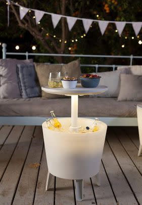 Keep your drinks cold in this illuminated ice cooler cocktail table