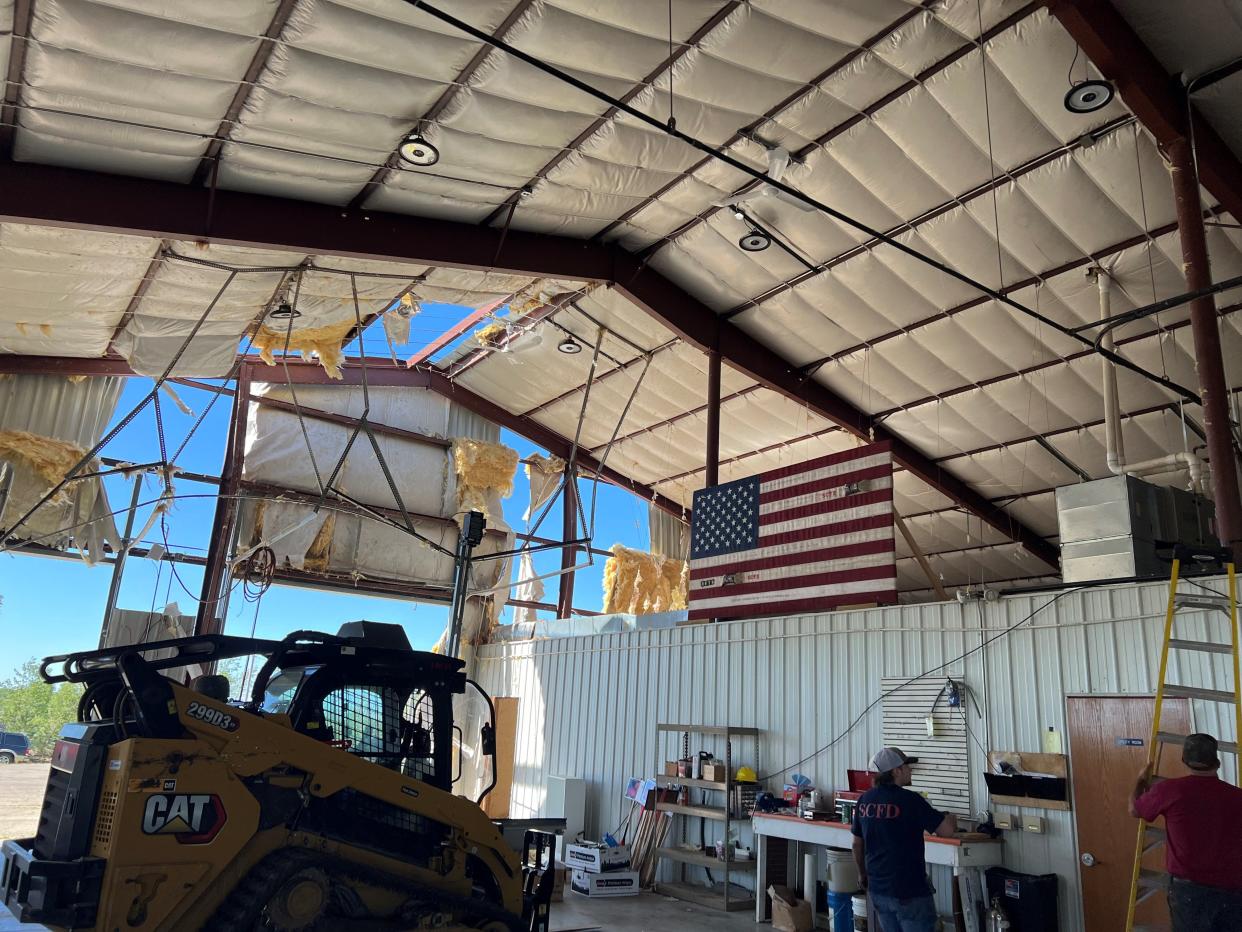An American flag made from old firehoses was unscathed, but the firehouse where it hangs was nearly a total loss after an EF-2 tornado struck the Silver Cliff Volunteer Fire Department in Marinette County on June 15.