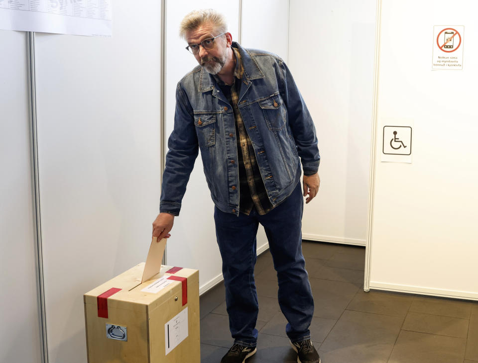 Gunnar Smari Egilsson, candidate for the Socialist Party, casts his vote in Reykjavik, Iceland, Saturday, Sept. 25, 2021. Icelanders are voting in a general election dominated by climate change, with an unprecedented number of political parties likely to win parliamentary seats. (AP Photo/Brynjar Gunnarsson)