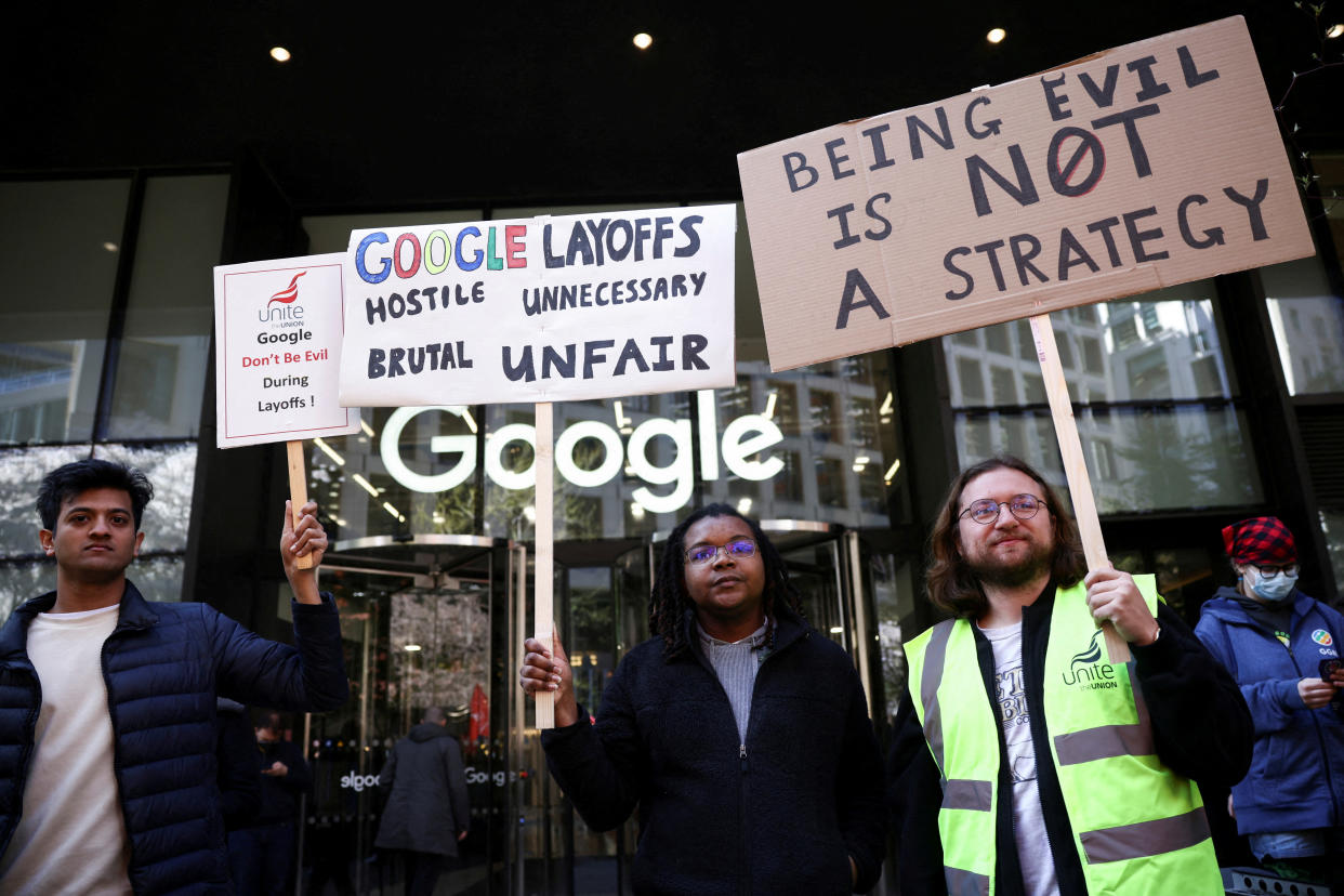 Google worker Shaquille and others hold signs, including a reference to the company's 