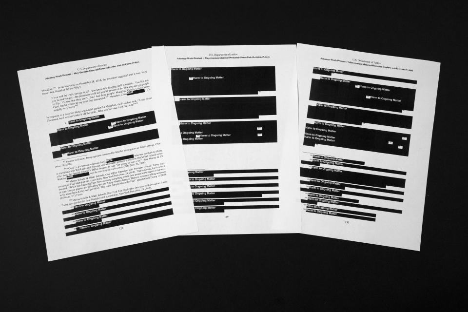 Special counsel Robert Mueller's redacted report on the investigation into Russian interference in the 2016 presidential election is photographed Thursday, April 18, 2019, in Washington. The pages refer to former campaign chairman Paul Manafort. (AP Photo/Jon Elswick)