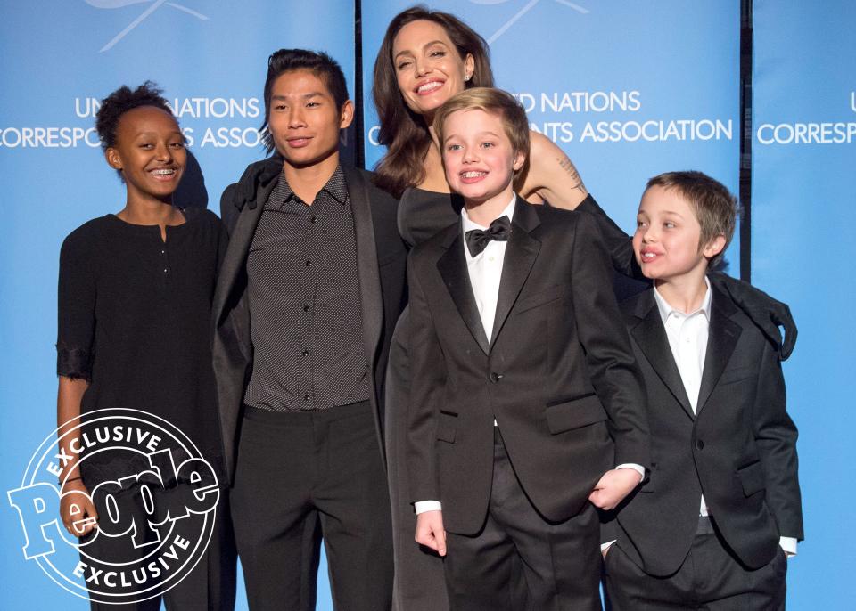 The previous day, the filmmaker <a href="http://people.com/movies/angelina-jolie-brings-kids-maddox-shiloh-music-event-nyc/" rel="nofollow noopener" target="_blank" data-ylk="slk:brought along four of her children;elm:context_link;itc:0;sec:content-canvas" class="link ">brought along four of her children</a> to accompany her to the 2017 United Nations Correspondents Association Awards at Cipriani Wall Street, where Jolie was honored as the <a href="https://www.google.com/search?ei=uog1WtKlGae_jwSoqp7ADg&q=2017+United+Nations+Correspondents+Association+Awards+angelina+jolie&oq=2017+United+Nations+Correspondents+Association+Awards+angelina+jolie&gs_l=psy-ab.3...1994.3892.0.3989.15.15.0.0.0.0.147.1221.7j5.12.0....0...1.1.64.psy-ab..3.4.395...33i160k1.0.1Jn-u_iOQKE" rel="nofollow noopener" target="_blank" data-ylk="slk:2017 UNCA Global Citizen of the year;elm:context_link;itc:0;sec:content-canvas" class="link ">2017 UNCA Global Citizen of the year</a>. She was photographed at the event alongside her sons Pax and Knox, plus daughters Zahara and Shiloh. While the actress's other two children — Maddox and Vivienne — were not present for the event, there was a good reason why they decided to sit the night out. "Vivienne had an upset tummy and big brother Maddox stayed with her," a source told PEOPLE.