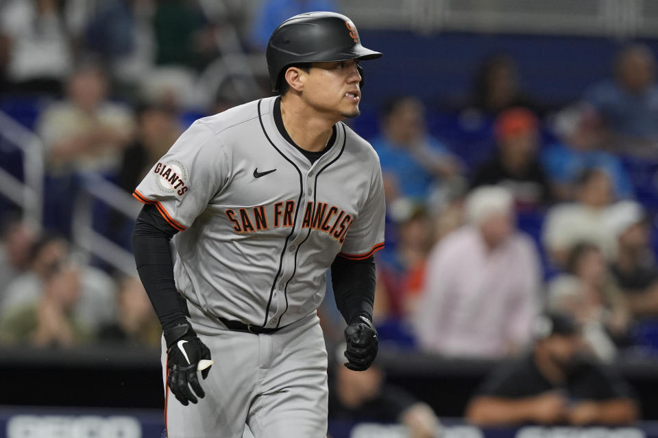 San Francisco Giants Wilmer Flores hits a single to center that lead Nick Ahmed to score the go ahead run during the seventh inning of a baseball game against the Miami Marlins, Monday, April 15, 2024, in Miami. (AP Photo/Marta Lavandier)
