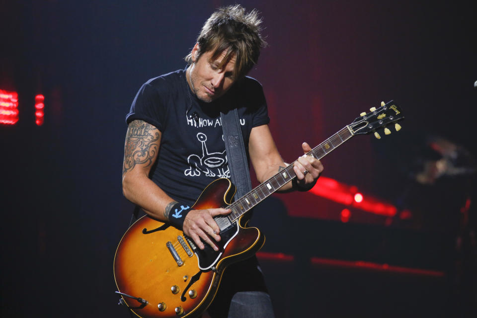 Keith Urban performs at the iTunes Festival during the SXSW Music Festival Saturday March 15, 2014, in Austin, Texas. (Photo by Jack Plunkett/Invision/AP)