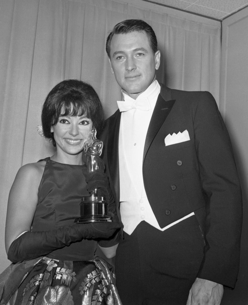 Rita Moreno poses with her Oscar and actor Rock Hudson after she was named best supporting actress of the year at the Academy Award Oscars at Santa Monica, Ca., on April 9, 1962. She won her award for best supporting actress for her part in the film West Side Story.