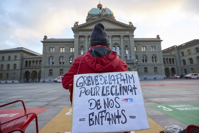 Fernandez sits during his hunger strike in the Federal Square in a bid to make Swiss government take bold action on climate change to safeguard his children's future in Bern