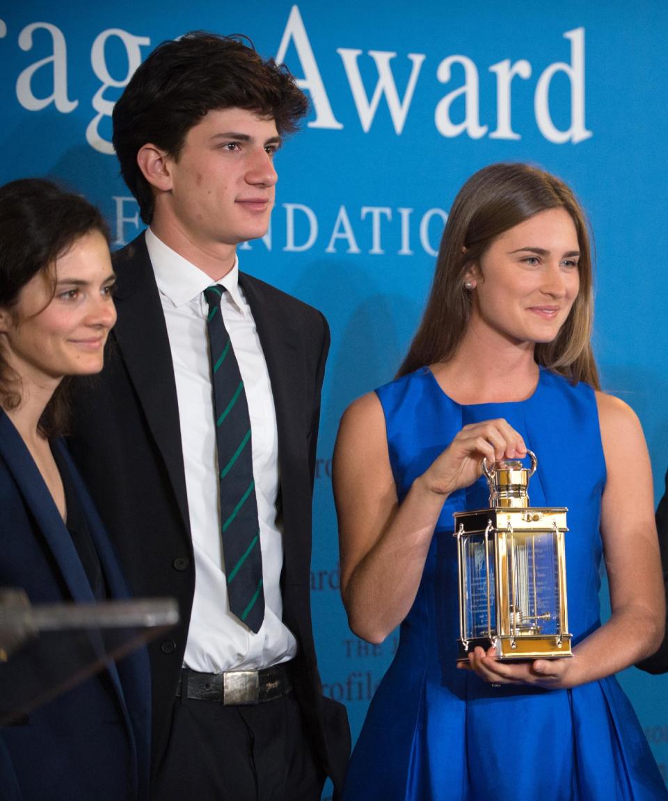 Lauren Bush Lauren, right, granddaughter of Former President George H.W. Bush, stands with Jack Schlossberg, center and Rose Schlossberg, left, grandchildren of President John F. Kennedy, after accepting the 2014 John F. Kennedy Profile in Courage Award on behalf of her grandfather during a ceremony at the John F. Kennedy Library and Museum, Sunday, May 4, 2014, in Boston. (AP Photo/Gretchen Ertl)