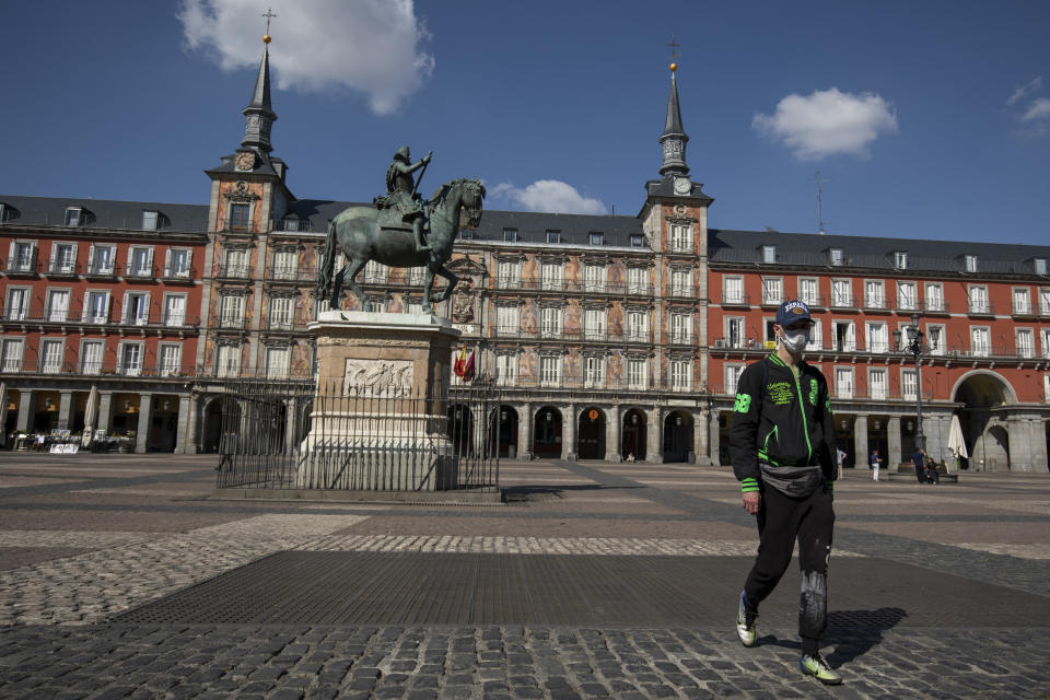 MADRID, SPAIN - MARCH 14: A man wears a protective mask as he walks along Plaza Mayor Square on March 14, 2020 in Madrid, Spain. The Spanish government has declared a state of emergency and is imposing a 15 day nationwide lockdown to control the spread of the novel coronavirus.  Nonessential businesses will have to close temporarily. (Photo by Pablo Blazquez Dominguez/Getty Images). Source: Getty