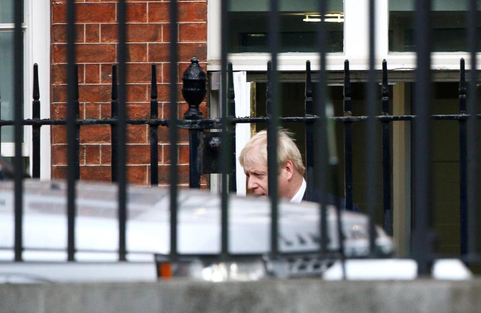 Boris Johnson leaves Downing Street after the Cabinet meeting was cut short (REUTERS)