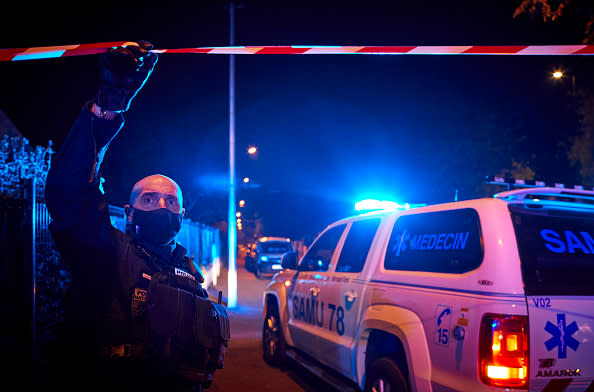 Police at the scene of the crime where a man was found decapitated near the Bois D'Aulne middle school in Conflans-Sainte-Honorine, France.