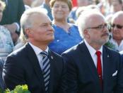 Lithuanian President Gitanas Nauseda and Latvian President Egils Levits attend an event to commemorate the anniversary of the Baltic Way on the border with Latvia near Salociai