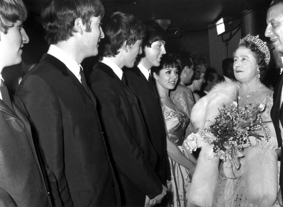 Queen Elizabeth III speaks to The Beatles after a Royal Variety Show at the Prince of Wales Theatre, London in 1963.