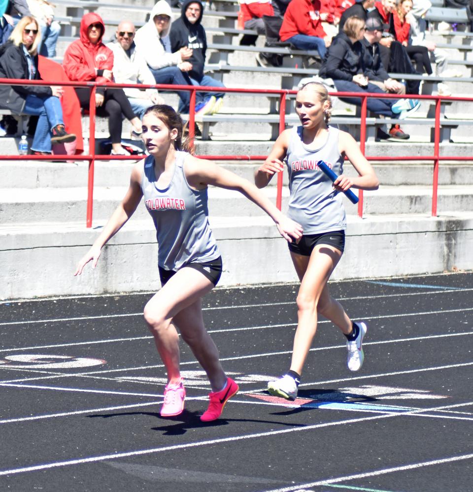 Coldwater's gold medal winning 800 meter relay team looks for a smooth hand off on their way to the win. Pictured is Miyah Moore handing off to Ella Thompson