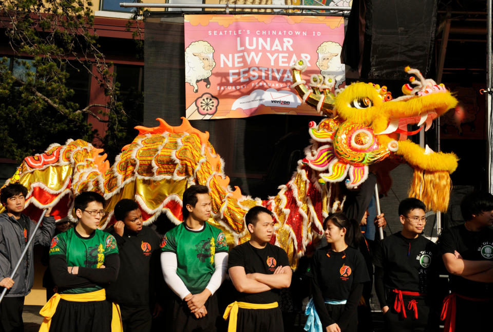 People watch a Lion Dance during a Chinese Lunar New Years celebration in Seattle (Kevin Schafer / Getty Images file)