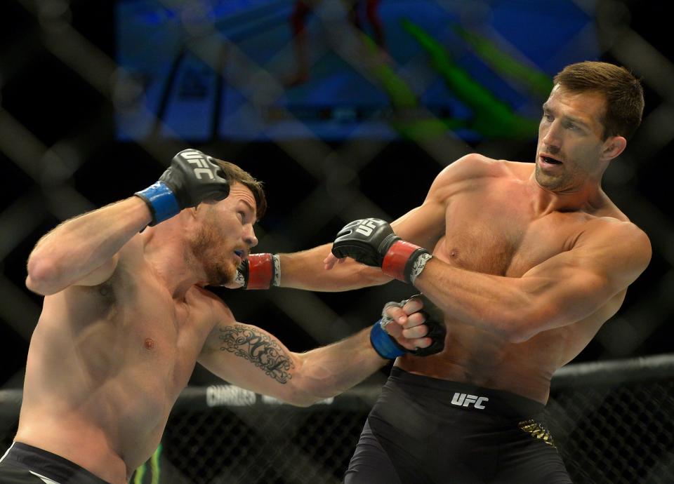 Luke Rockhold (R) would love to get another crack at UFC middleweight champ Michael Bisping. (Getty)