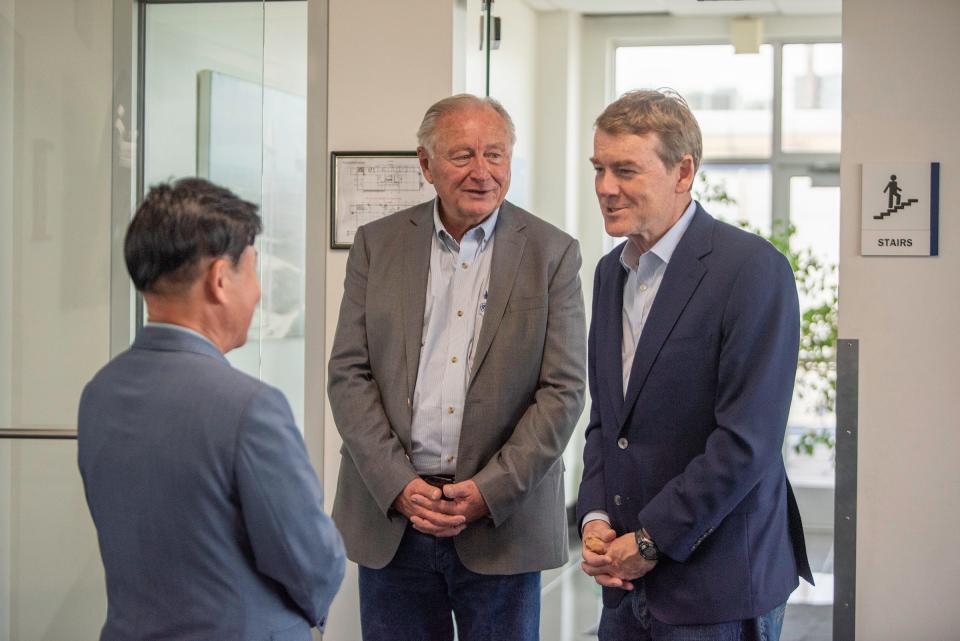 U.S. Sen. Michael Bennet, right, and Pueblo Mayor Nick Gradisar, center, meet with CS Wind Chairman Seong-Gon Gim during a tour of the Pueblo facility on Friday, August 25, 2023.