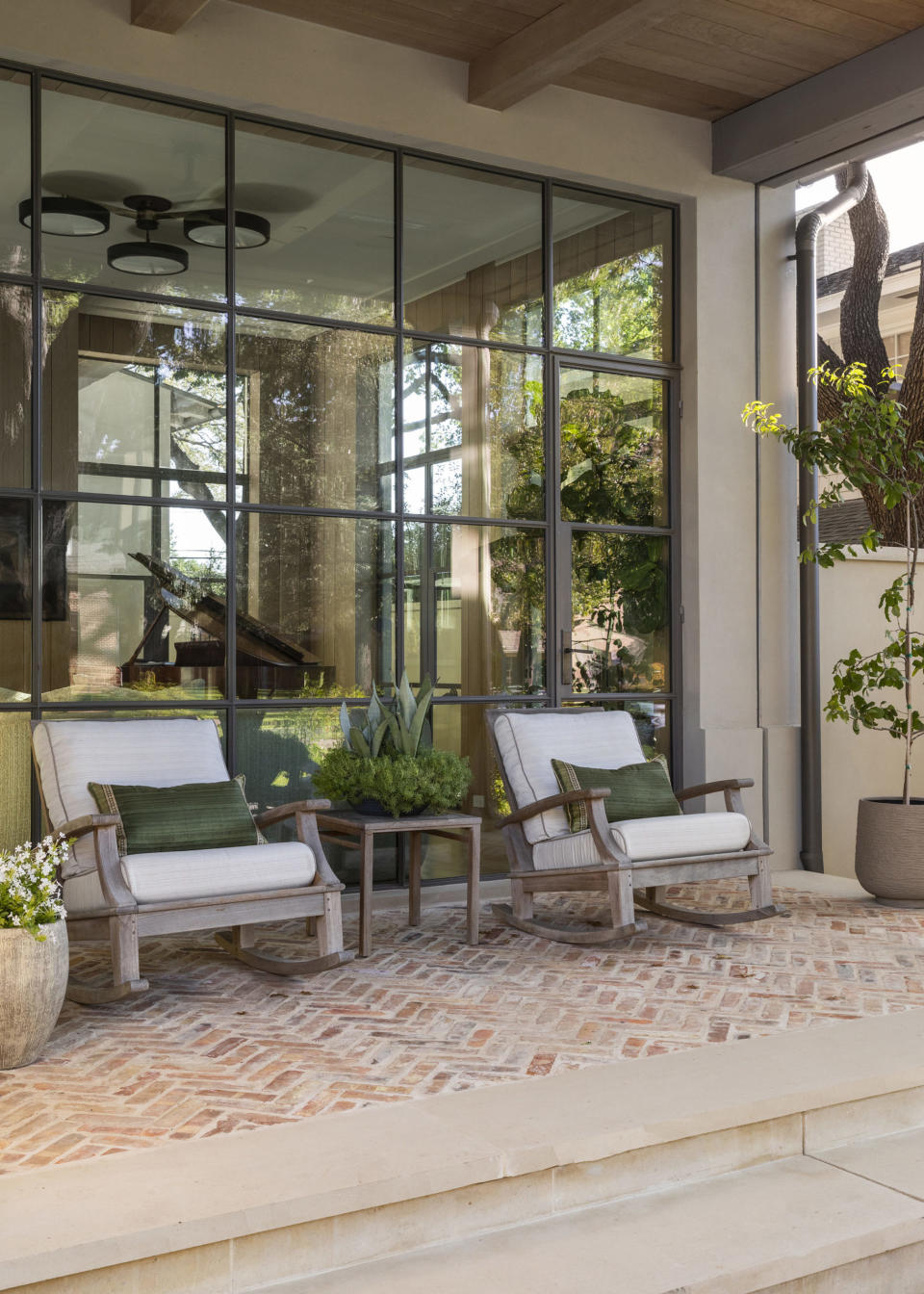 terracotta tiled terrace with concrete flower pots by Ryan Street