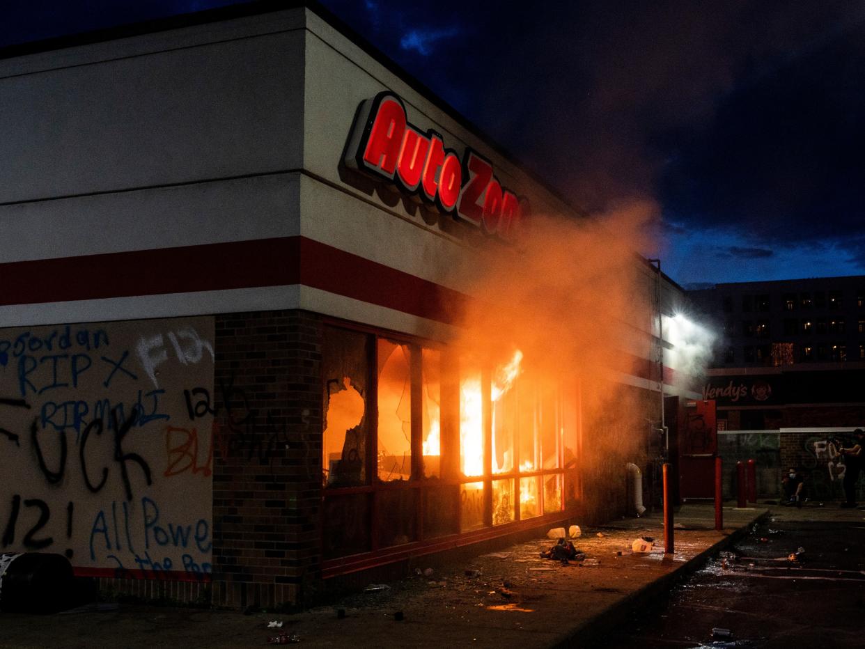 A fire burns inside of an Auto Zone store near the 3rd Police Precinct on May 27, 2020 in Minneapolis, Minnesota. Stephen Maturen:Getty Images)