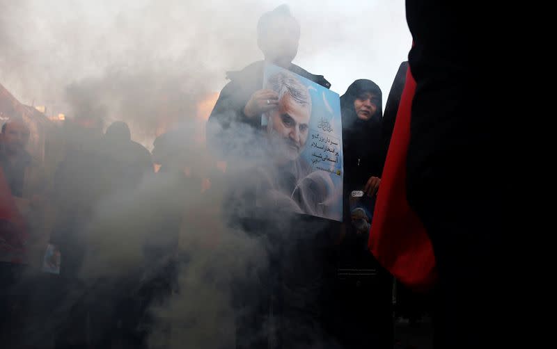 Iranian people attend a funeral procession for Iranian Major-General Qassem Soleimani, head of the elite Quds Force, and Iraqi militia commander Abu Mahdi al-Muhandis, who were killed in an air strike at Baghdad airport, in Tehran