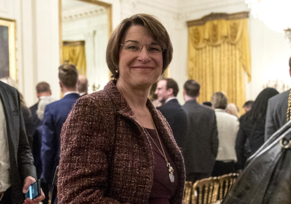 FILE - IN this Nov. 16, 2018, file photo, Sen. Amy Klobuchar, D-Minn., departs following a Medal of Freedom ceremony in the East Room of the White House in Washington. House and Senate negotiators have reached an agreement on a bill to overhaul the process for handling sexual misconduct allegations on Capitol Hill. The push for the legislation took on new urgency in the past year, as more than a half-dozen lawmakers resigned amid allegations of sexual misconduct. (AP Photo/Andrew Harnik, File)