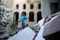 <p>Mustafa al-Now is seen on debris in the Old City of Aleppo, Syria, July 16, 2017. (Photo: Omar Sanadiki/Reuters) </p>