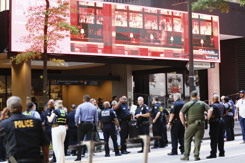 Multiple agencies work the scene where multiple people were injured Tuesday, June 11, 2024, during a shooting in a busy downtown Atlanta, food court at the Peachtree Center. (Miguel Martinez/Atlanta Journal-Constitution via AP)