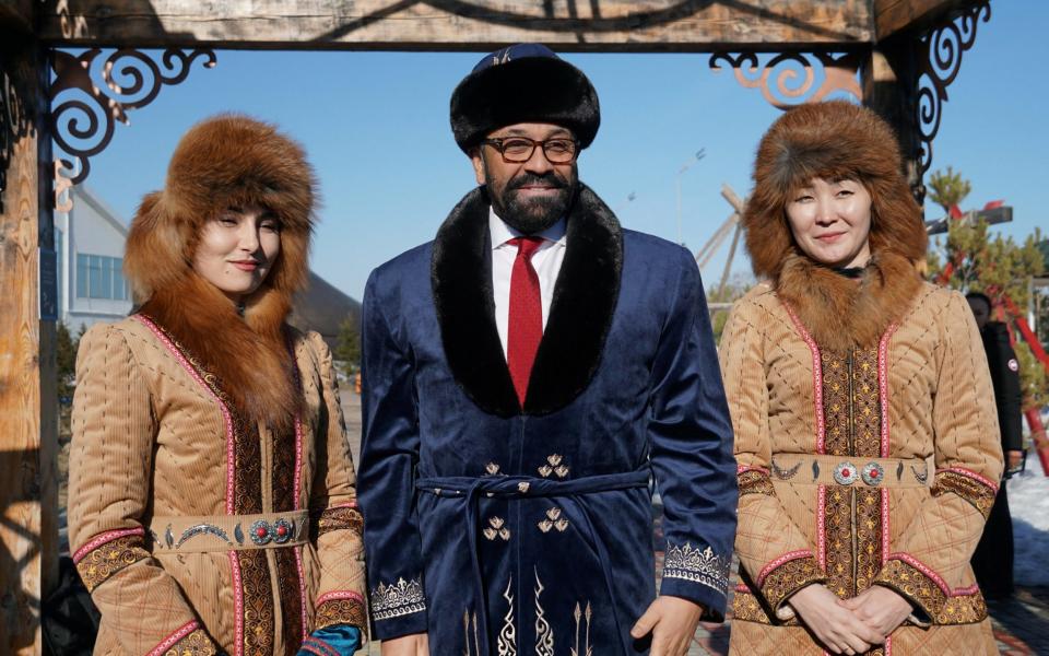 Mr Cleverly poses with locals near Astana - Reuters