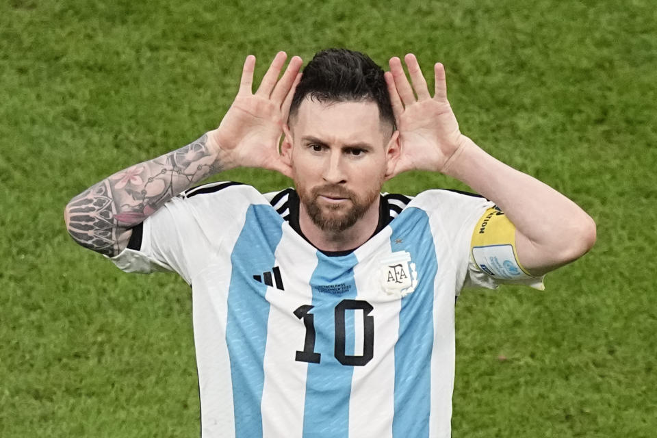 Argentina's Lionel Messi celebrates after scoring during the World Cup quarterfinal soccer match between the Netherlands and Argentina, at the Lusail Stadium in Lusail, Qatar, Friday, Dec. 9, 2022. (AP Photo/Ariel Schalit)